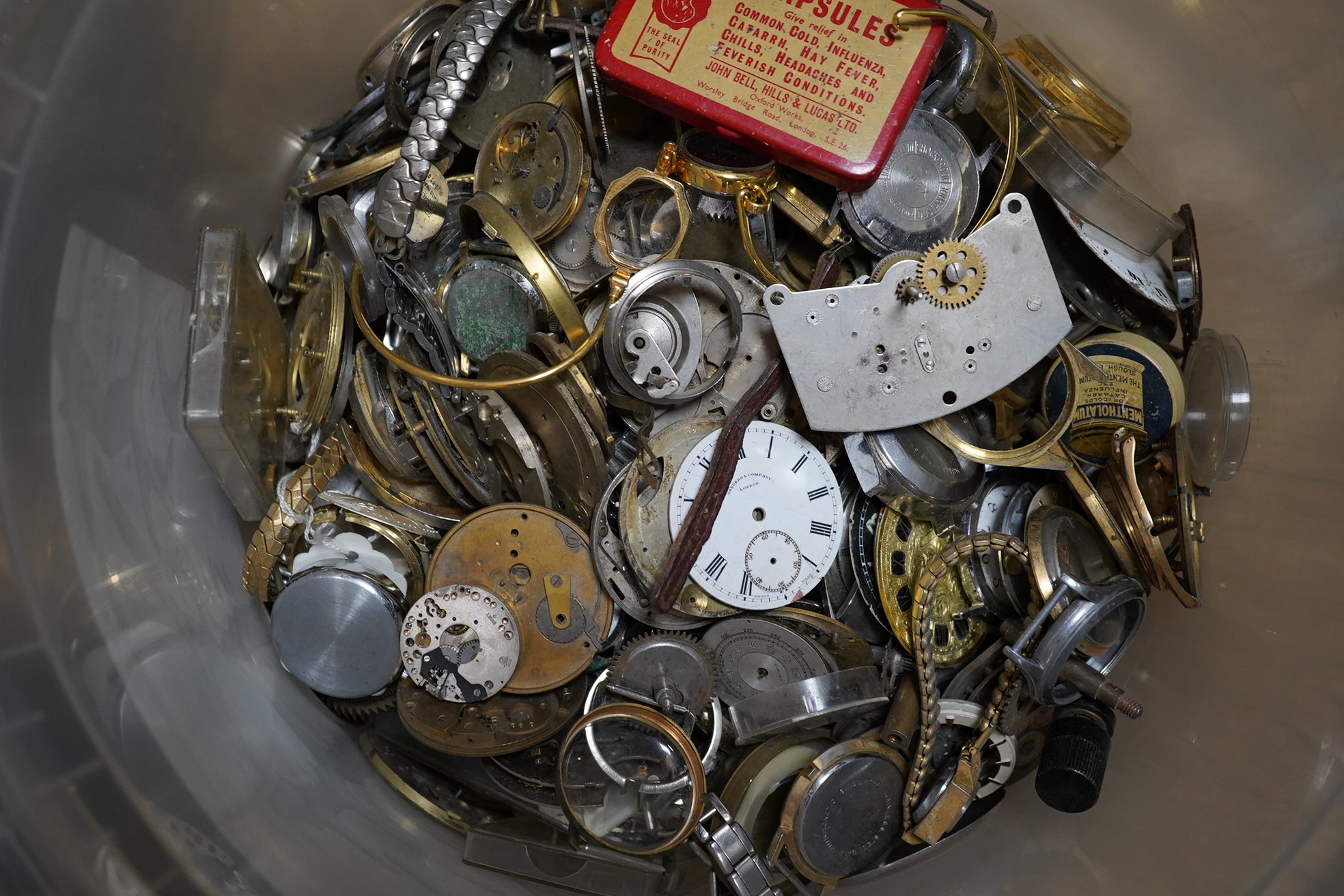 A large quantity of watch parts, spares etc from a watchmaker's studio. Condition - poor to fair